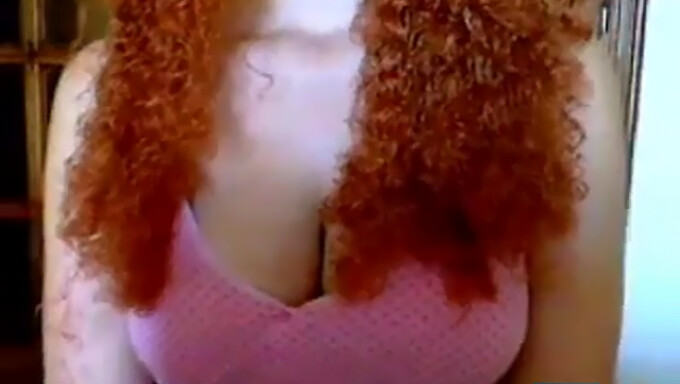 Curly-Haired Redhead Shows Off Her Assets On Webcam