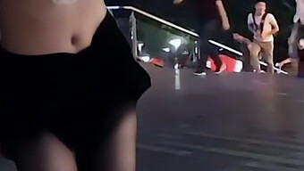 A Chinese Woman Is Discovered Indecently Exposing Herself In A Public Setting.